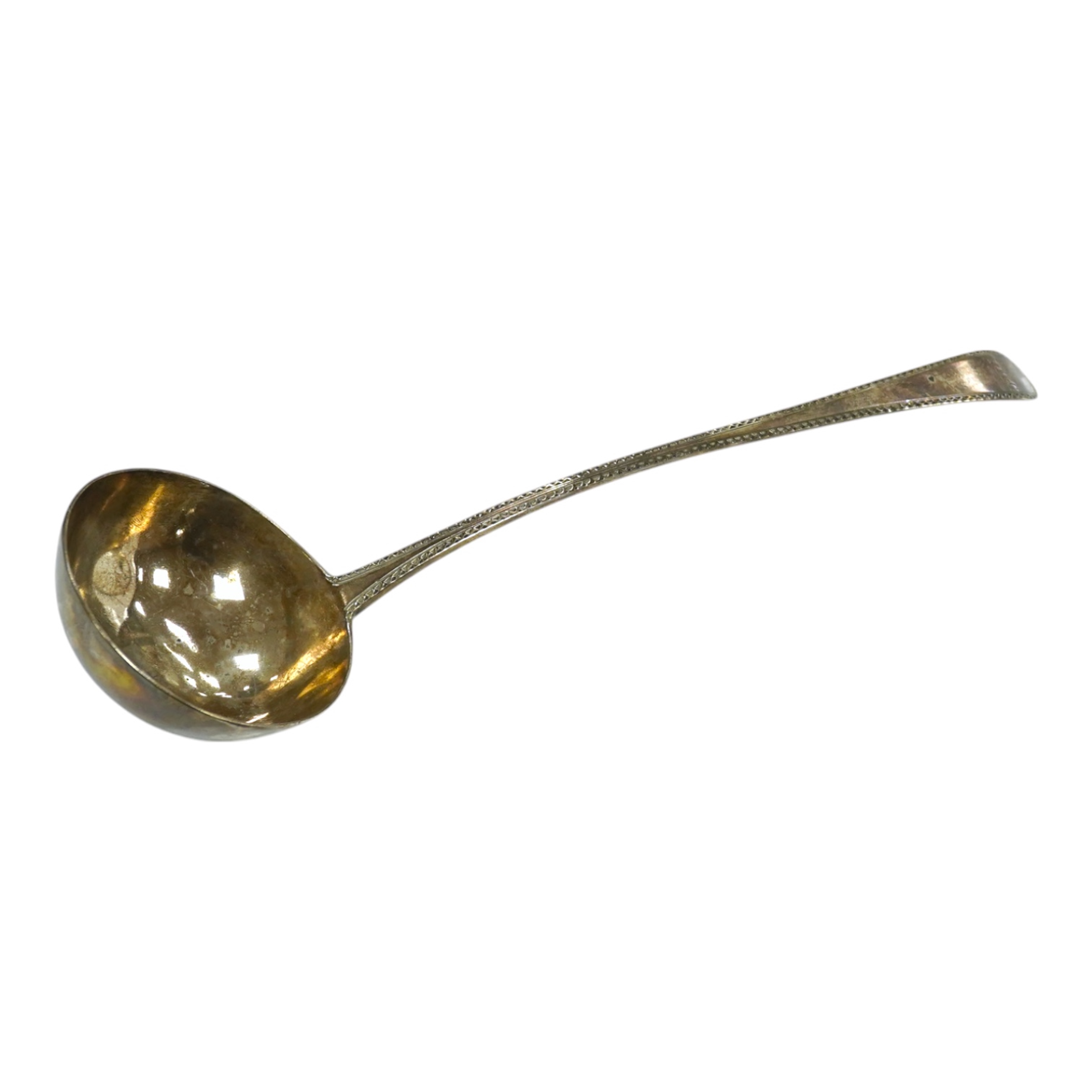 An 18ct century silver Old English pattern soup ladle, pinched marks, 32.8cm, 4.5oz. Condition - poor to fair